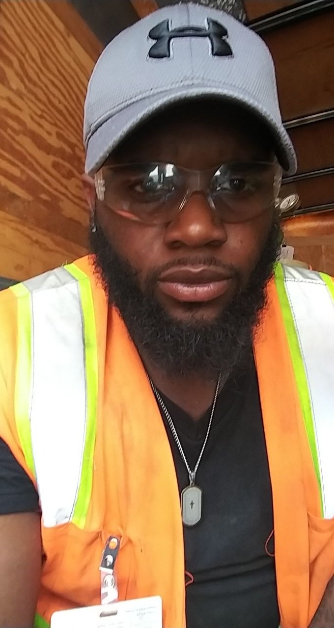 Photo of Donald Brown in a safety vest and baseball cap.